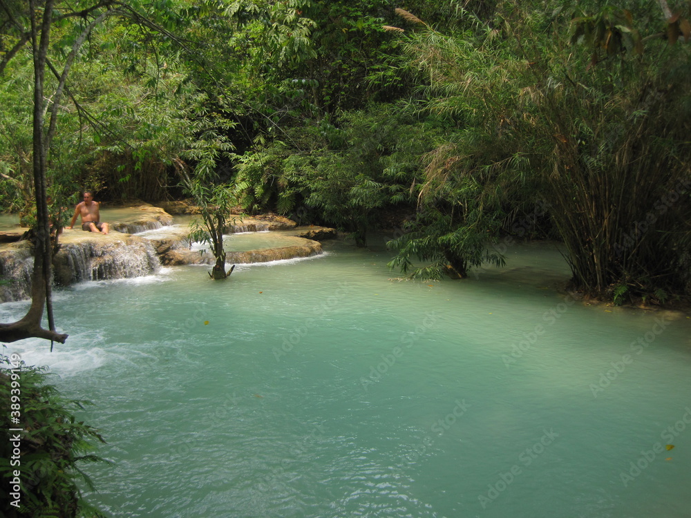 Backpacking through the waterfalls and jungles down the Mekong River in Laos, Southeast Asia Backpacking through the waterfalls and jungles down the Mekong River in Laos, Southeast Asia