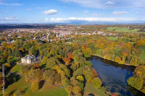 A beautiful aerial photo in the autumn fall at the park in Leeds West Yorkshire known as Roundhay Park showing the brown and green colours on the trees