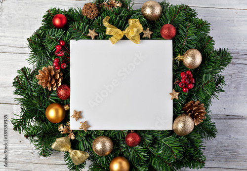 Christmas tree branches with paper card note