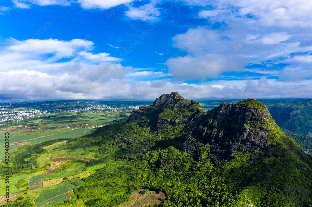 Fototapeta premium Aerial view of the Mont du Rempart mountain, corps de grande,.Mont saint Pierre region Black River, behind the places Vacoas-Phoenix and Quatre Bornes, Mauritius, Africa