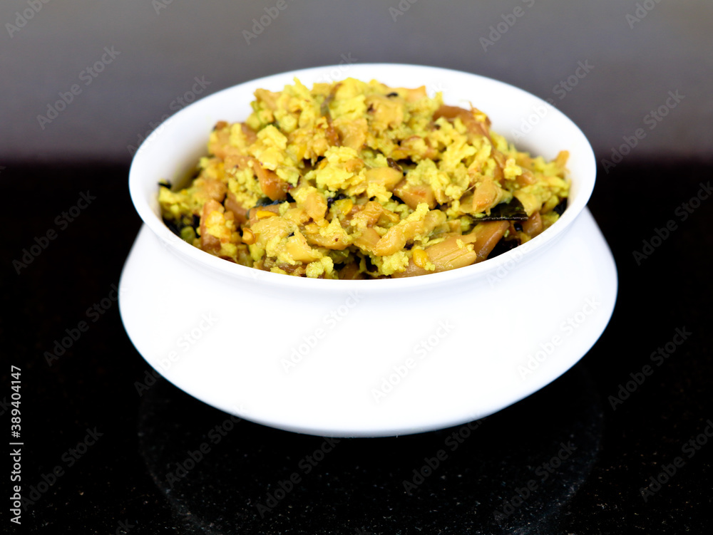 Perum koon or Kerala mushroom curry prepared with bird eye chili and curry leaves Perum koon or Kerala mushroom curry prepared with bird eye chili and curry leaves