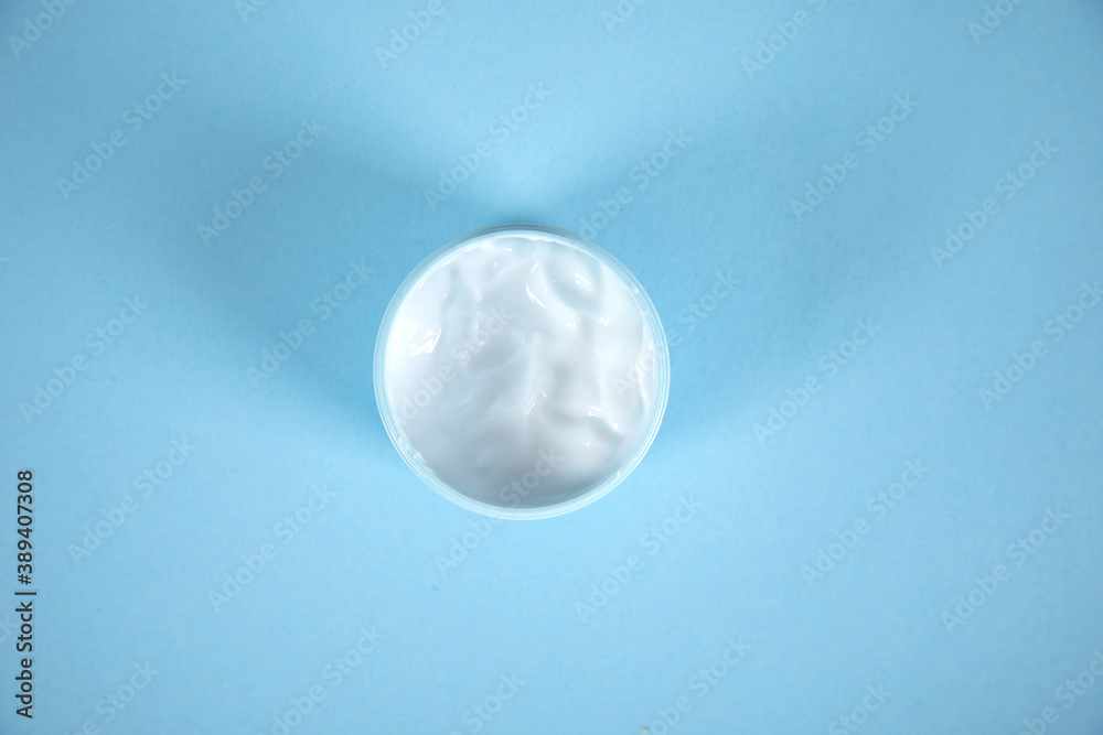 face cream on the blue table face cream on the blue table