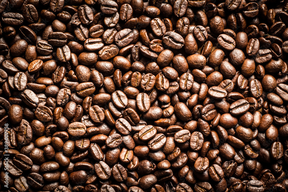 Naklejka premium Roasted Coffee Beans background texture. 