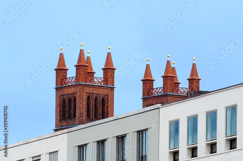 Berlin, Germany, mix of modern and ancient architecture, blue sky. Friedrichswerdersche Kirche photo
