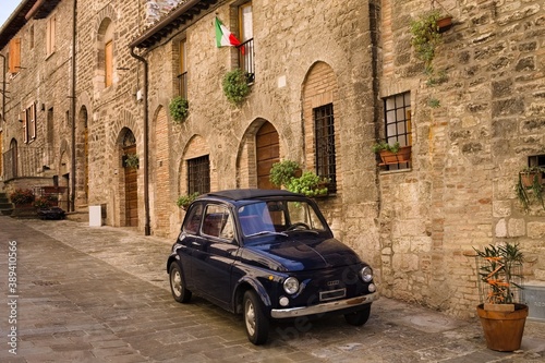 An alley of an Italian medieval village with an old car parked (Gubbio, Umbria, Italy) © Tommaso