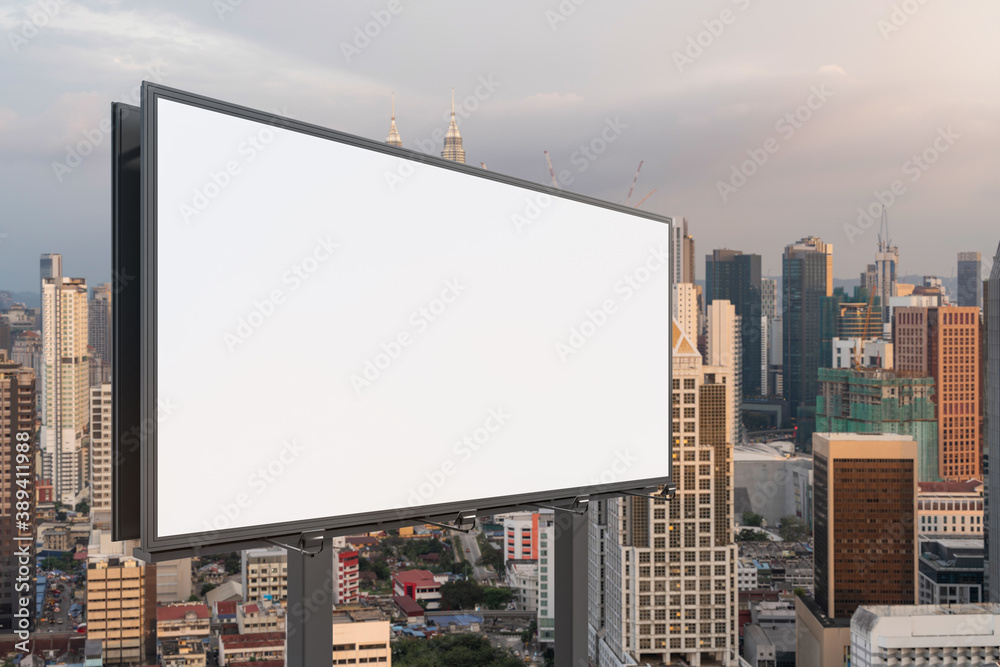 Blank white road billboard with Kuala Lumpur cityscape background at sunset. Street advertising poster, mock up, 3D rendering. Side view. Blank white road billboard with Kuala Lumpur cityscape background at sunset. Street advertising poster, mock up, 3D rendering. Side view.