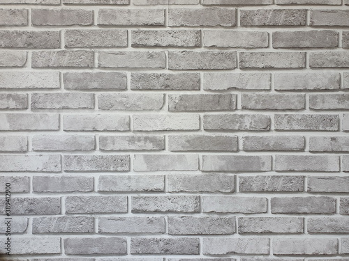 The texture of a gray brick wall or an unevenly colored brick wall is perfect for adding text or as a background. 