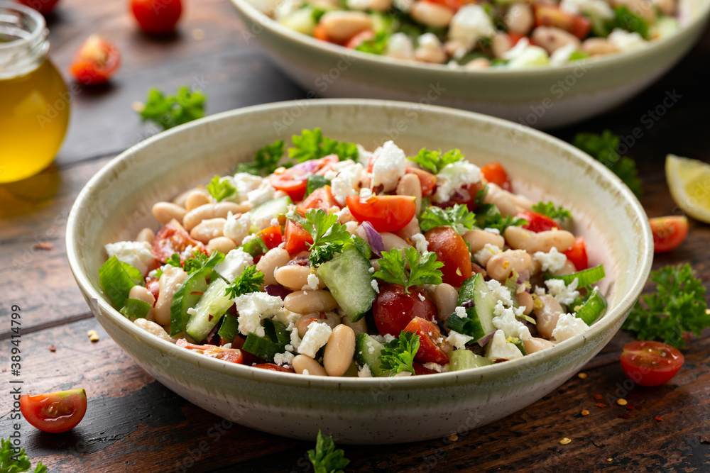 Bean Salad with Cherry Tomatoes, Cucumber, Red onion, Feta cheese and parsley. Healthy vegetarian, vegan diet food Bean Salad with Cherry Tomatoes, Cucumber, Red onion, Feta cheese and parsley. Healthy vegetarian, vegan diet food