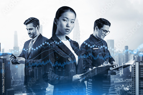 Canvas Print Group of business colleagues in suits as a part of multinational corporate team working on forecasting trading corporate strategy at fund