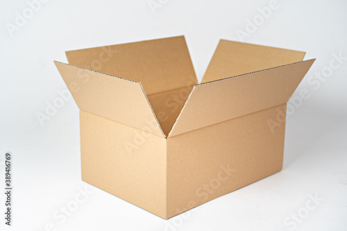 Brown carton box on a white background © Dawid