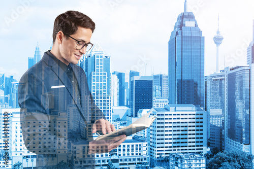 Canvas Print Young handsome businessman in suit and glasses thinking how to tackle the problem, new career opportunities, MBA assignment
