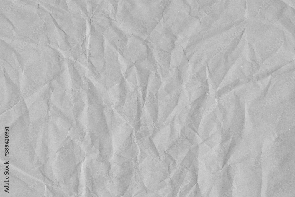 Fototapeta premium White vintage and old looking crumpled paper background. Retro cardboard texture. Grunge paper for drawing. Ancient book page. Present wrapping.