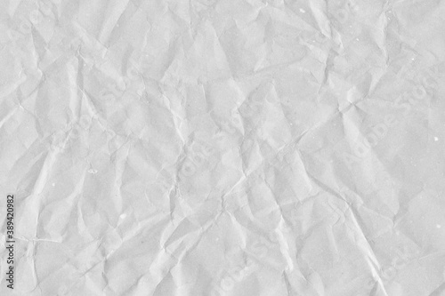 White vintage and old looking crumpled paper background. Retro cardboard texture. Grunge paper for drawing. Ancient book page. Present wrapping.