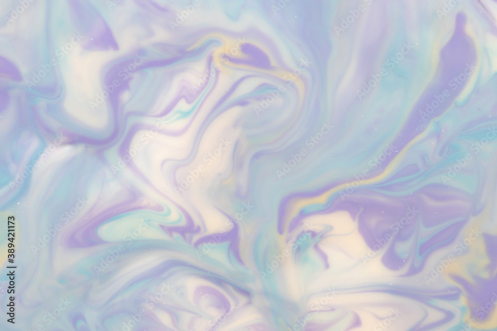 Abstract background of mixed shades of nail polish with a pastel marble pattern. Liquid colorful paint background creative pastel with a light shimmer, white lilac, blue, cold