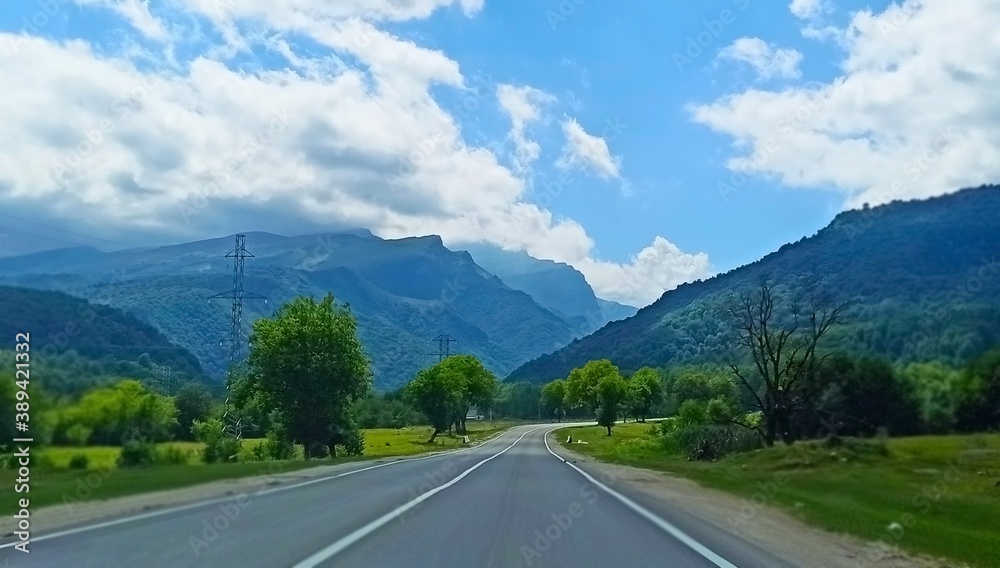 A beautiful road leads to the mountains