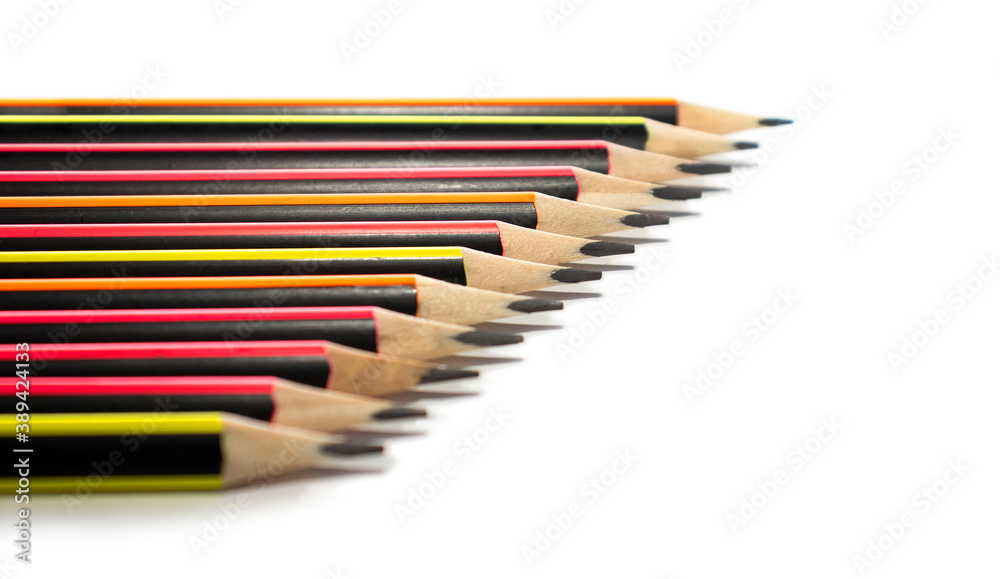 Bright simple pencils folded on a white background with space for text. Selective focus.