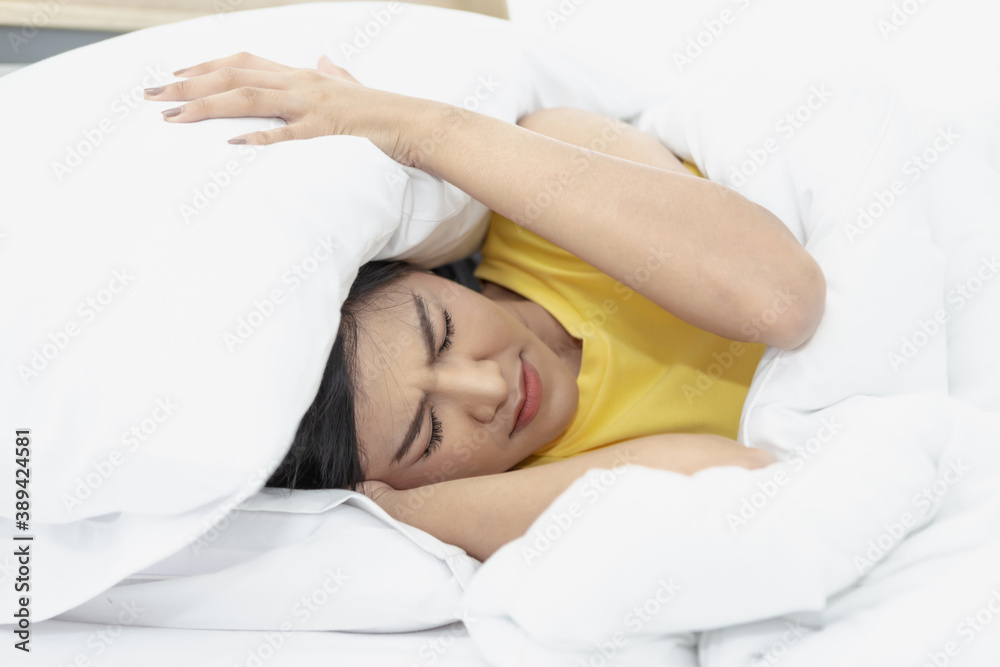 Young beautiful Asian woman hates waking up early in the morning. Young beautiful Asian woman hates waking up early in the morning.