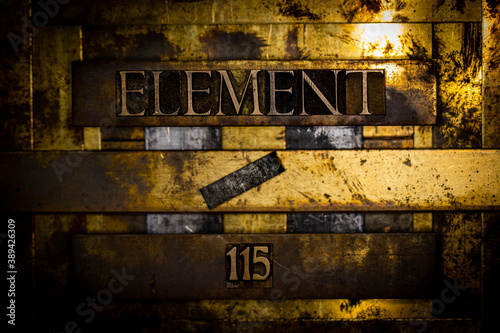 Element 115 text message on textured grunge copper and vintage gold background photo