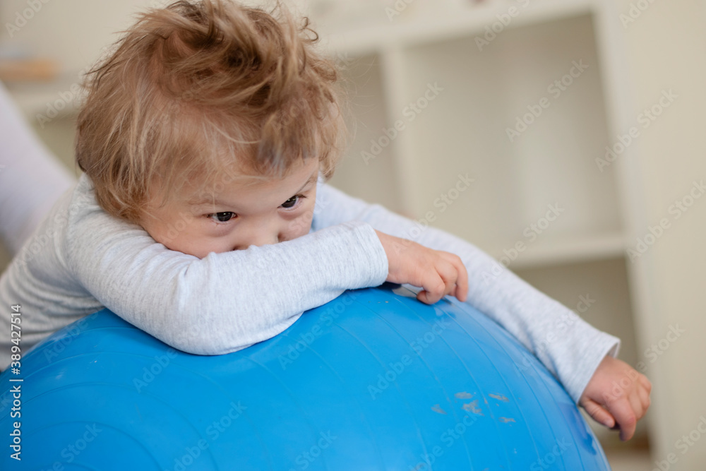 Portrait of a child with cerebral palsy on physiotherapy in a children