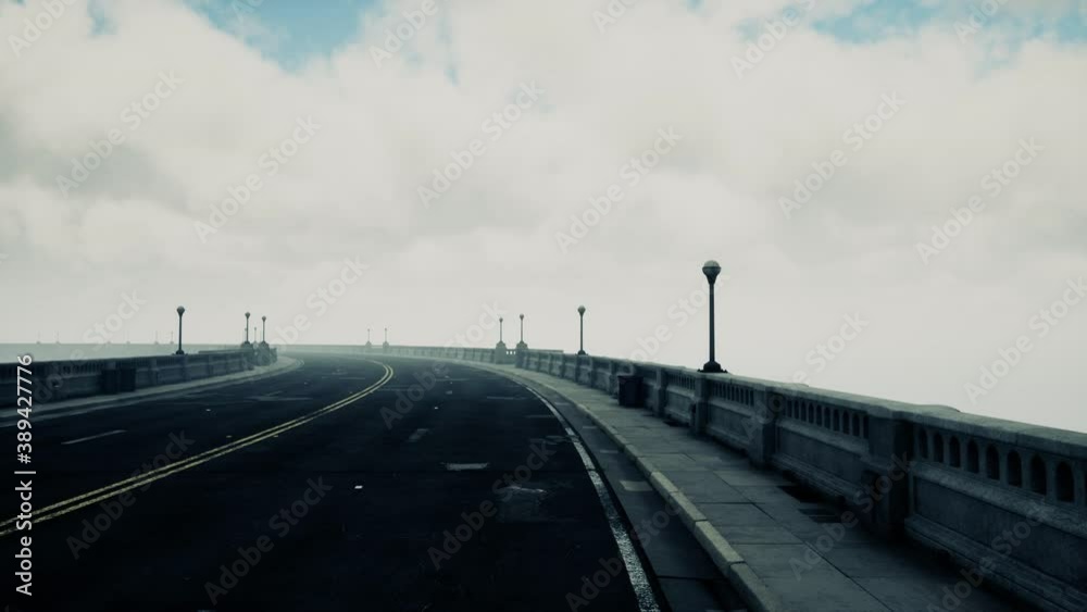 long bridge in misty fog long bridge in misty fog