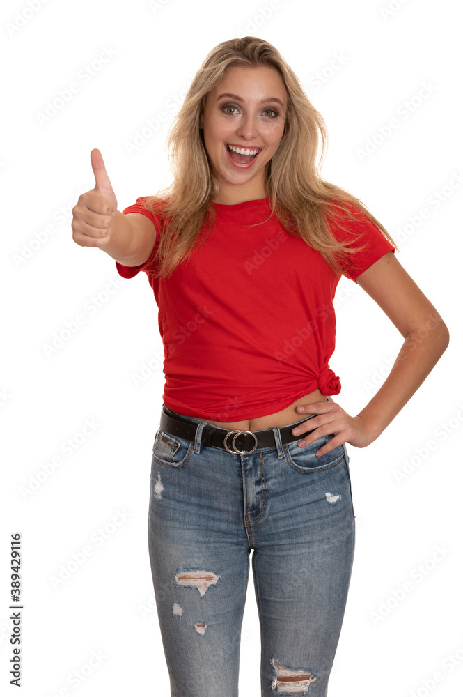 Beautiful young woman shows thumb up as a gesture for success Beautiful young woman shows thumb up as a gesture for success