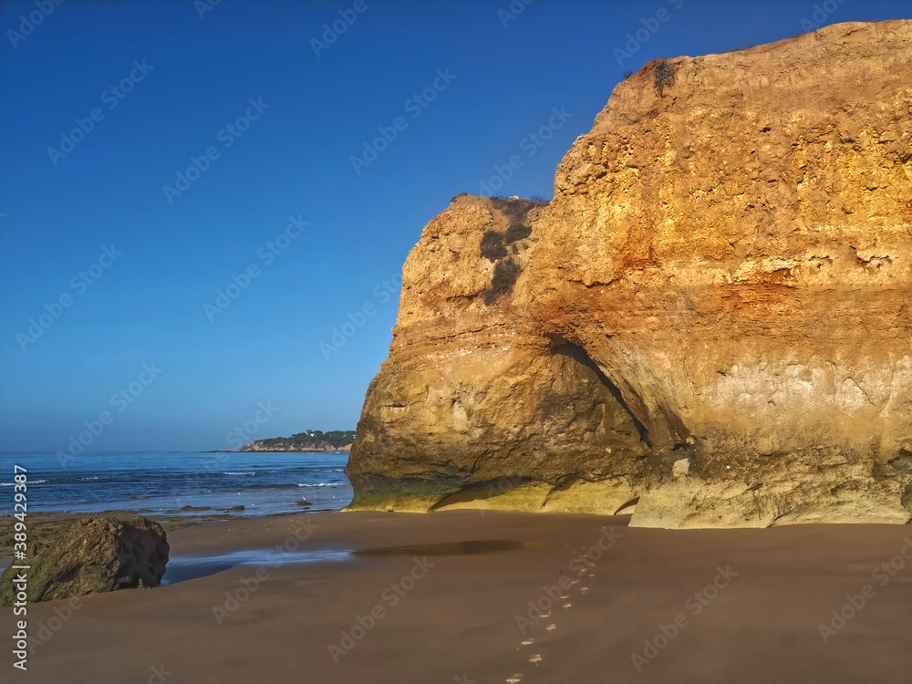 Hinking at the beach of Praia Maria Luisa, Olhos da Agua, Albufeira, at the Algarve coast of Portugal
