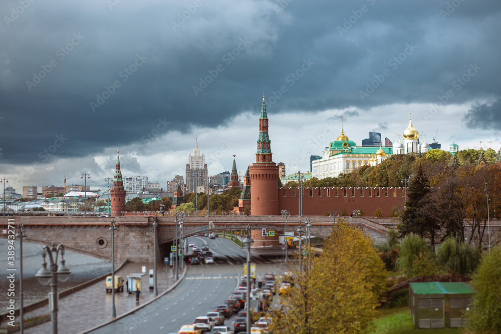 View of the kremlin's part in and the Great zamoskvoretsky bridge with traffic from cars in cloudy weather. View of the kremlin's part in and the Great zamoskvoretsky bridge with traffic from cars in cloudy weather.