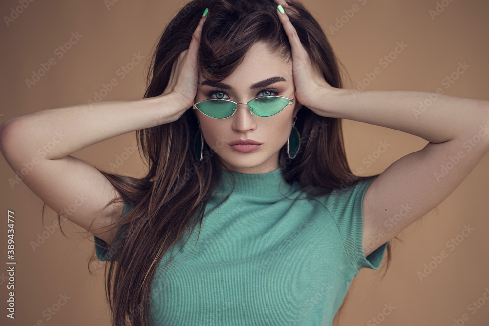 young stylish girl in green glasses, comfortable and natural clothes. Natural femininity and beauty young stylish girl in green glasses, comfortable and natural clothes. Natural femininity and beauty
