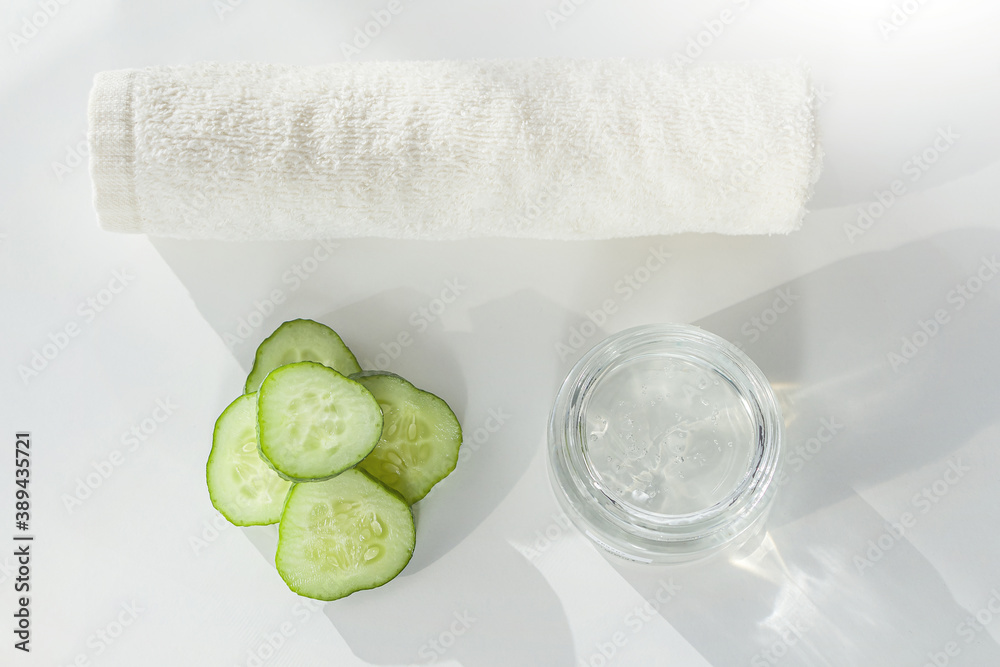 Spa Facial skin care: Cucumber Slices, Mask and Towel. Cleansing and moisturizing cucumber cosmetics. Natural organic ingredients to homemade beauty products Spa Facial skin care: Cucumber Slices, Mask and Towel. Cleansing and moisturizing cucumber cosmetics. Natural organic ingredients to homemade beauty products
