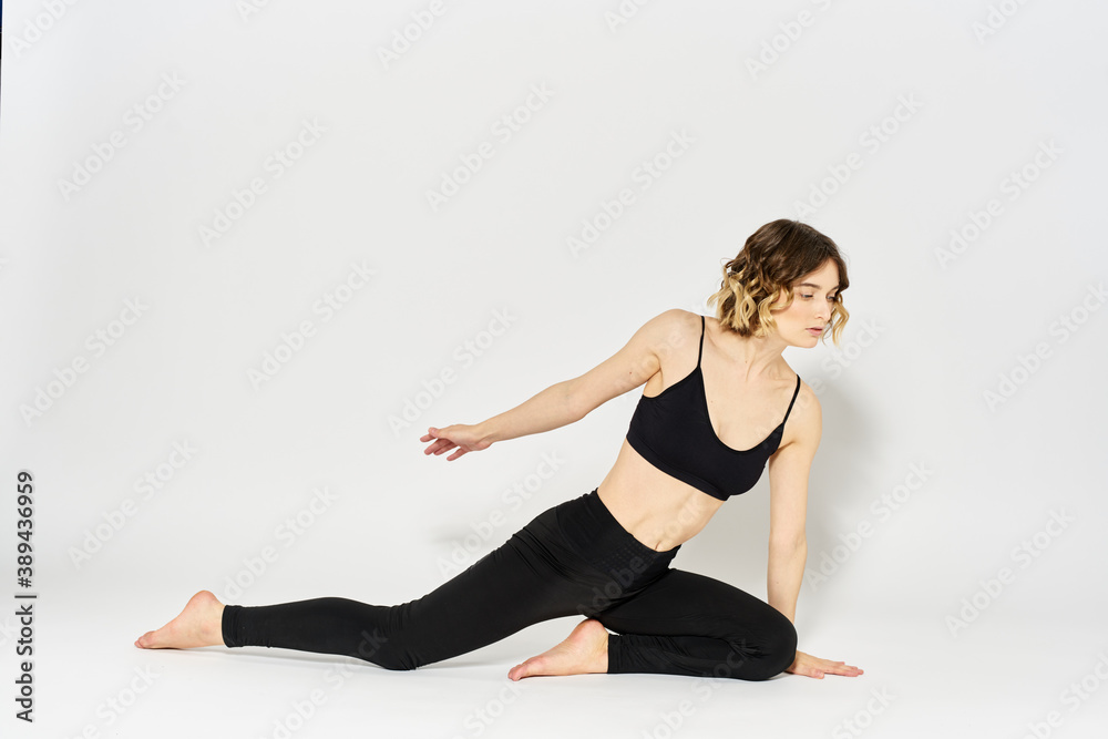 woman in dark clothes sitting on the floor and meditation exercises for legs leggings woman in dark clothes sitting on the floor and meditation exercises for legs leggings