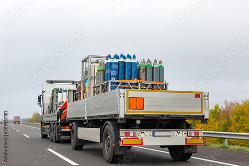 Transportation of cylinders with oxygen for patients with coronavirus. Truck delivering gas cylinders for medical purposes