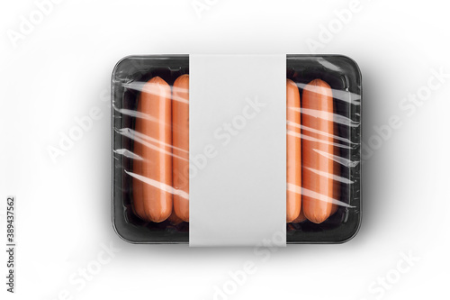 Sealable black plastic tray of fresh raw sausages with white paper label isolated on white top-view. Packaging template mockup collection. With clipping Path included. photo