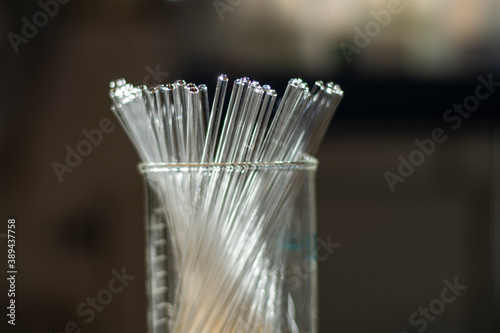 Various clean NMR tubes in a beaker in a chemistry laboratory for biotechnology research for drug