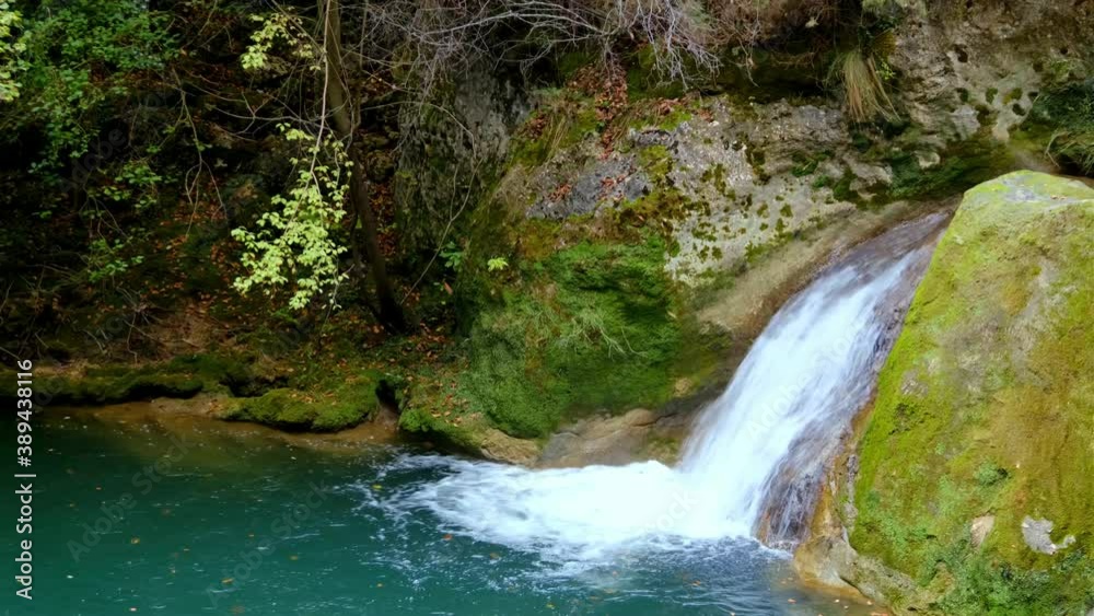 River and fallen leaves. Urederra river source in autumn. Urbasa-Andia Natural Park. Navarre, Spain, Europe. 4K. River and fallen leaves. Urederra river source in autumn. Urbasa-Andia Natural Park. Navarre, Spain, Europe. 4K.