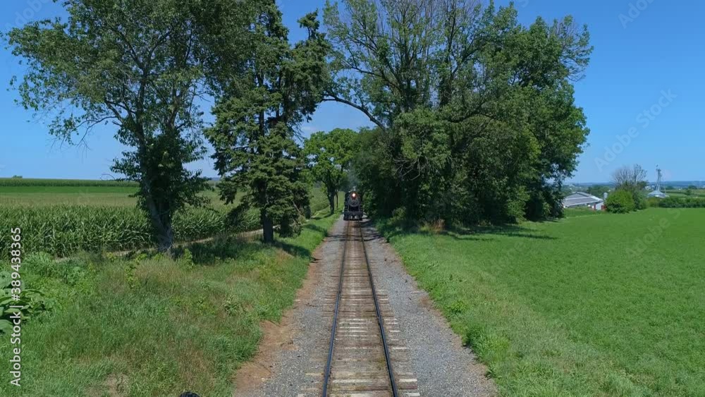 Aerial View of an Approaching Antique Steam Engine Head on View on a Beautiful Cloudless Summer Day Aerial View of an Approaching Antique Steam Engine Head on View on a Beautiful Cloudless Summer Day