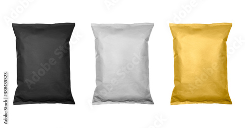 White, black and gold pillow bag of chips , snacks or candys top view. Isolated on a white background.