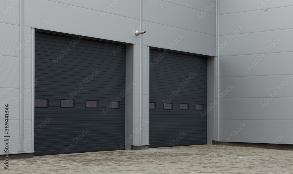 Obraz premium Roller door or roller shutter using for factory, warehouse or hangar.