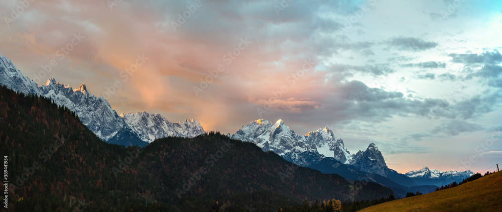 Mountain panorama at sunrise with Alpine Glow over the German Alps