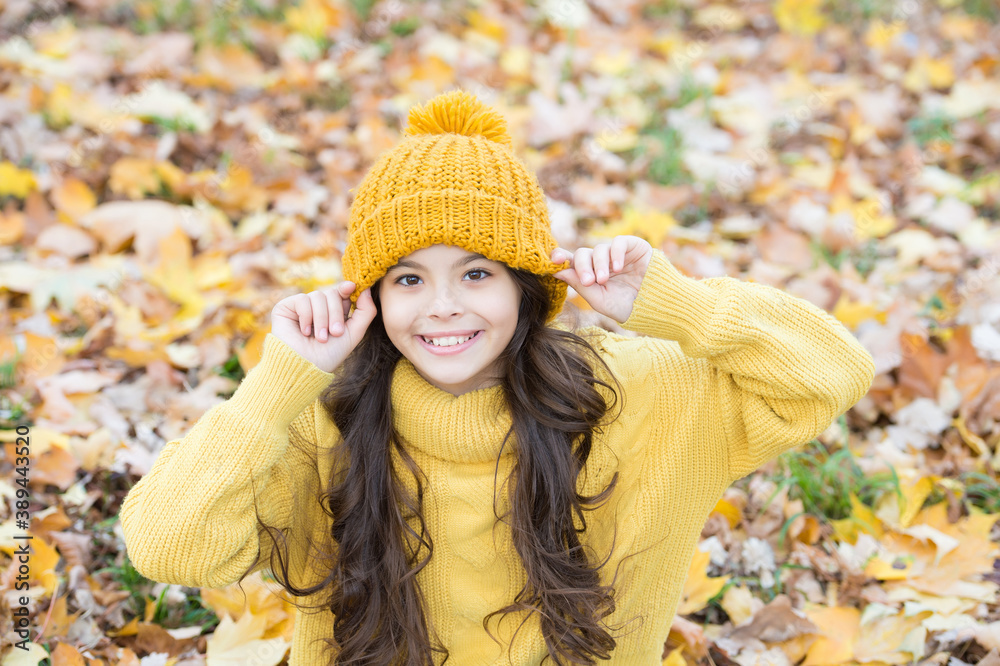 happy girl in casual style spend time in autumn park enjoying good weather wearing knitted hat and warm sweater, childhood happiness happy girl in casual style spend time in autumn park enjoying good weather wearing knitted hat and warm sweater, childhood happiness