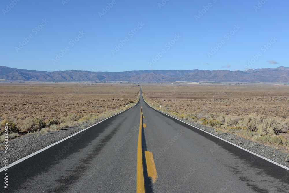 Road across a desert valley Road across a desert valley