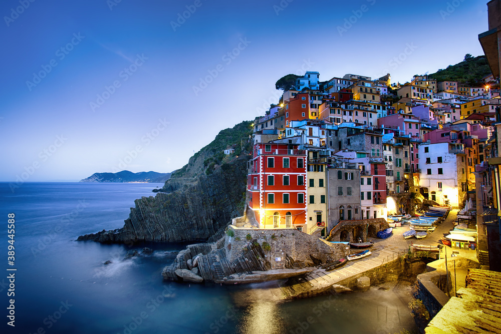 Riomaggiore is one of the towns of Cinque Terre in the early morning. It is a UNESCO World Heritage Site. Colorful landscape, urban architecture of a small town.  La Spezia, Liguria, Italy. 