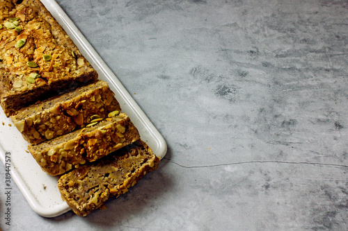 Wallpaper Mural Gluten free and sugar free pumpkin bread cut into pieces. Pumpkin cake with dried fruits, poppy seeds and honey on a dark table. Copy space. Vegan Pumpkin Pastry Torontodigital.ca