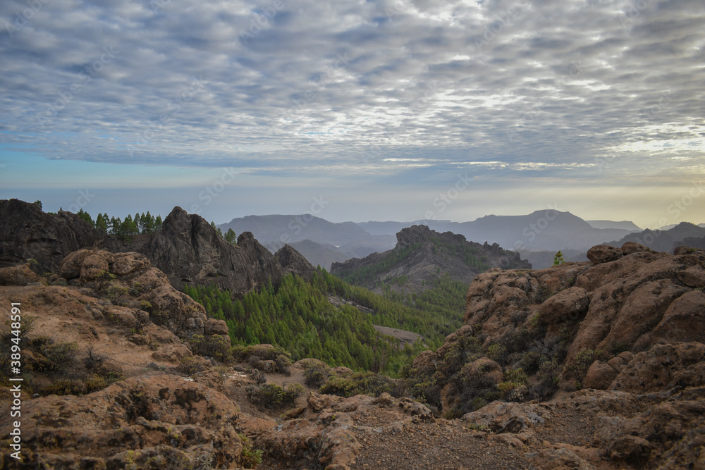 Valley full of mountains and volcanic rocks in Gran Canaria during sunset.