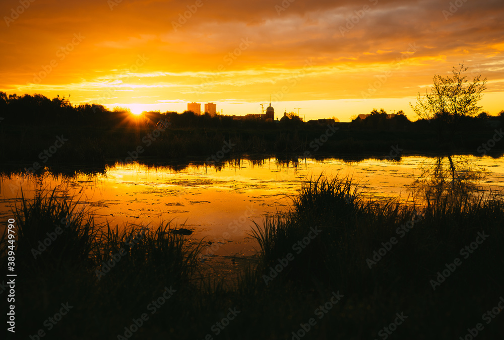 Obraz premium sunset over the river