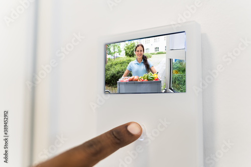 African Man Using Video Intercom System