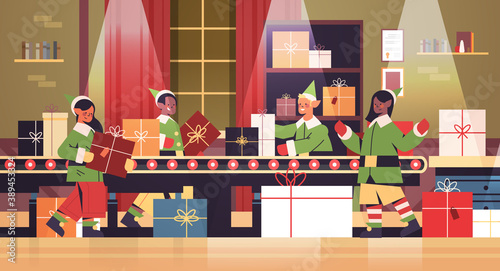 mix race elves putting gifts on machinery line conveyor happy new year christmas holidays celebration concept santa claus workshop interior horizontal full length vector illustration