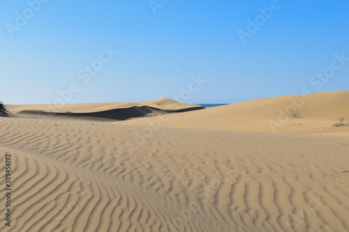 Large sand dunes in the desert.