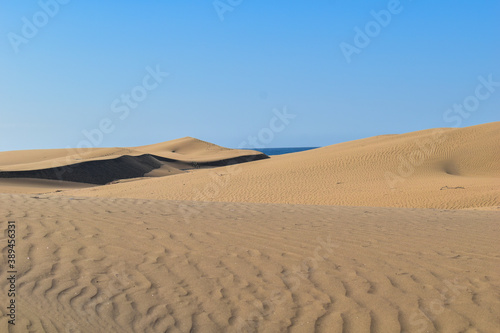 Large sand dunes in the desert.