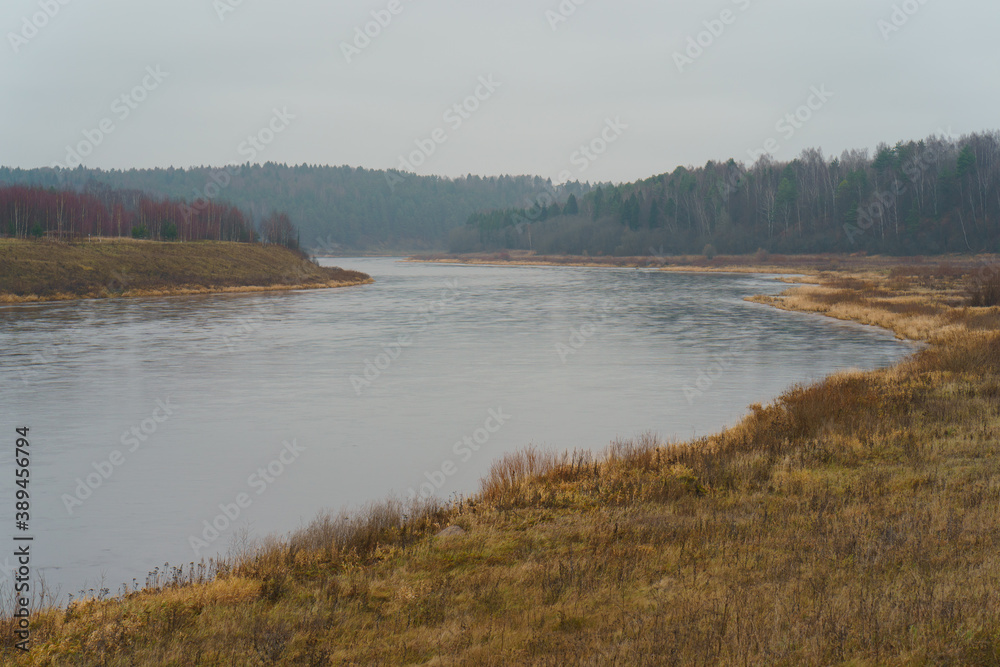 Photography of Russian country side in rainy day. Autumn landscape. Famous Volga river in Tver region. Concepts of travel and touristic mood and beauty of nature in bad wet weather.