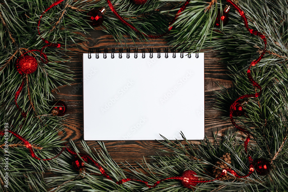 Merry christmas and merry new year concept with gift boxes, toys and notebook with background Merry christmas and merry new year concept with gift boxes, toys and notebook with background